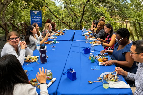 Members of the Palo Alto University community gather for the 50th Anniversary Community Luncheon during Celebration Week, sharing lunch and conversation on the Allen Calvin Campus.
