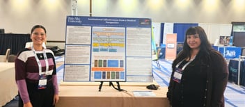 PAU students Bárbara Gómez-Cáceres and Lizeth Sotelo stand beside their award-winning research poster, "Institutional Effectiveness from a Student Perspective," at the 2026 WSCUC Academic Resource Conference.